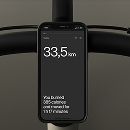 Smartphone mounted on handlebars displaying bike app interface